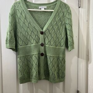 Cute sweater vest. New without tags